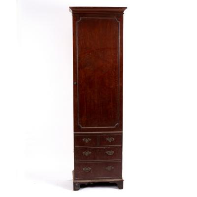 Appraisal: A narrow George III style mahogany hanging cupboard the panel