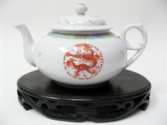 Appraisal: A Chinese Export Teapot on Wood Stand the pot having