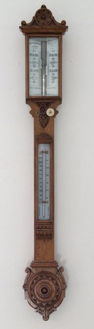 Appraisal: A Reynolds Branson oak cased stick barometer with ivory scale