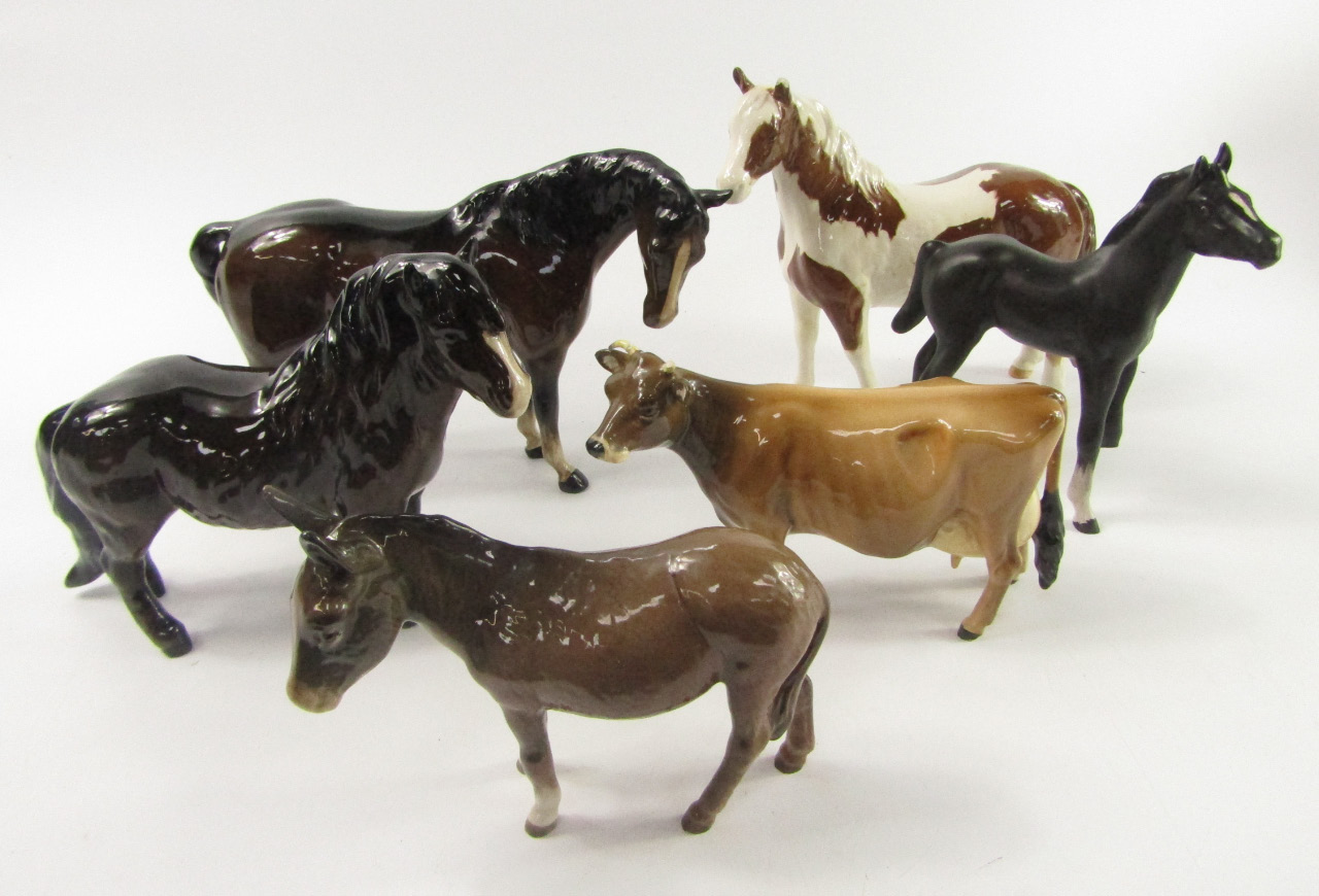 Appraisal: A Beswick Exmoor pony donkey and Newton Tinkle cow brown