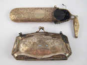 Appraisal: A silver chatelaine spectacle case with spectacles chain and pendant