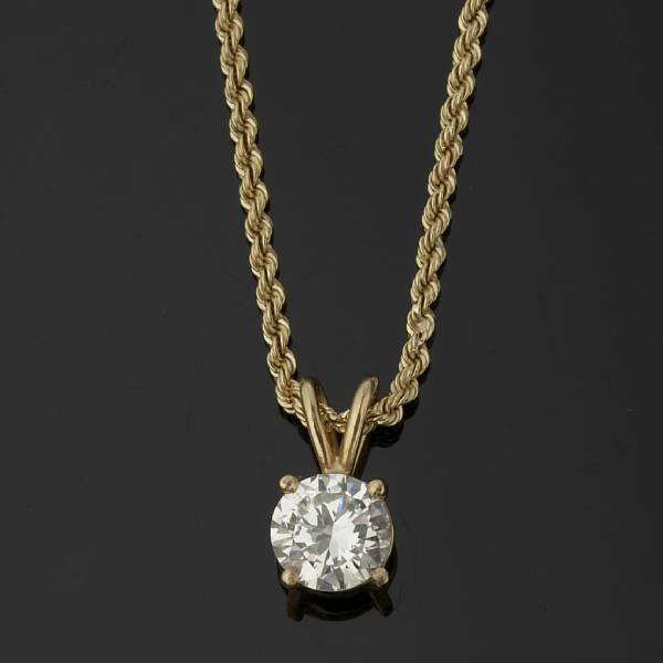 Appraisal: A diamond pendant with chain highlighting a round brilliant-cut diamond