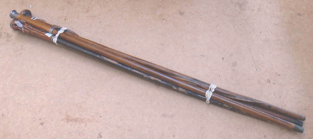 Appraisal: A Zulu hardwood walking stick carved with a snake running