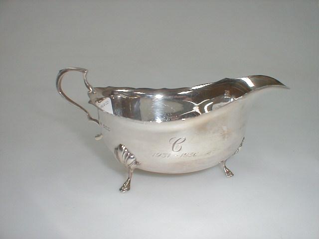 Appraisal: A Walker Hall silver sauce boat in the Georgian style