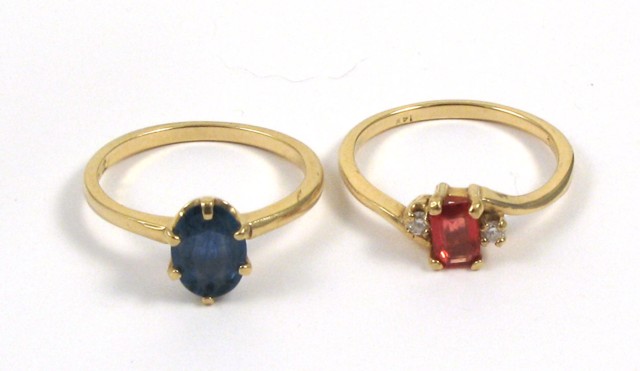 Appraisal: TWO SAPPHIRE AND YELLOW GOLD RINGS one set with an