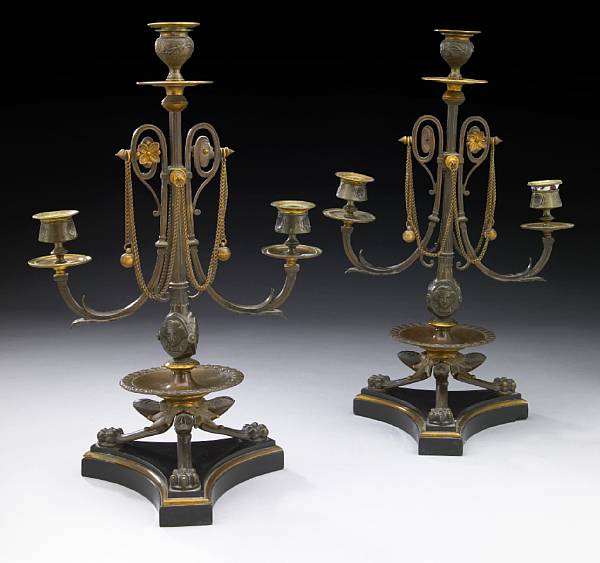 Appraisal: A pair of French Pompeiian style patinated bronze three light