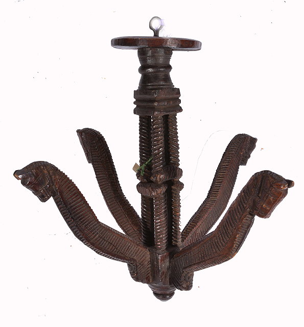 Appraisal: A GUJARATI CARVED WOODEN CLOTHES HANGER a central cluster column