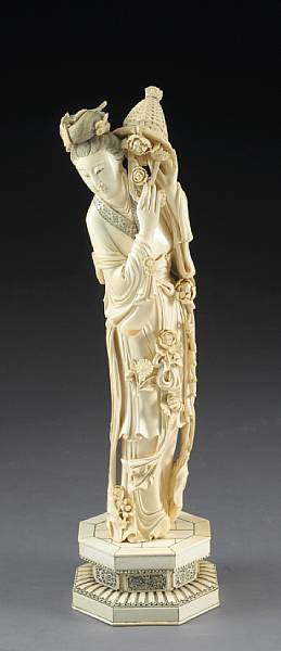 Appraisal: A tinted ivory beauty The standing figure dressed in layered