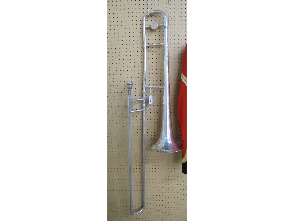 Appraisal: A trombone by Boosey and Hawkes with a music stand