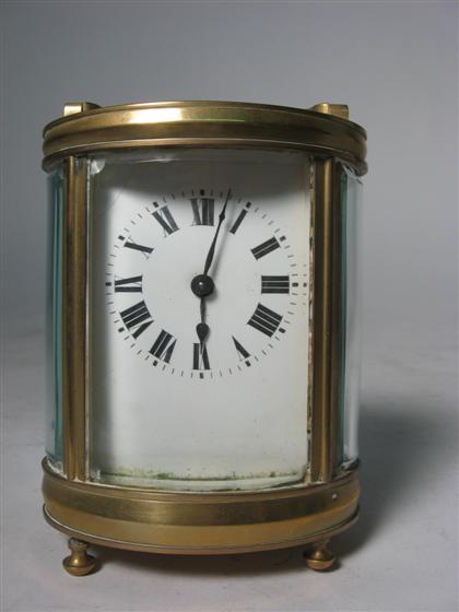 Appraisal: Oval French brass and glass carriage clock th century Swing