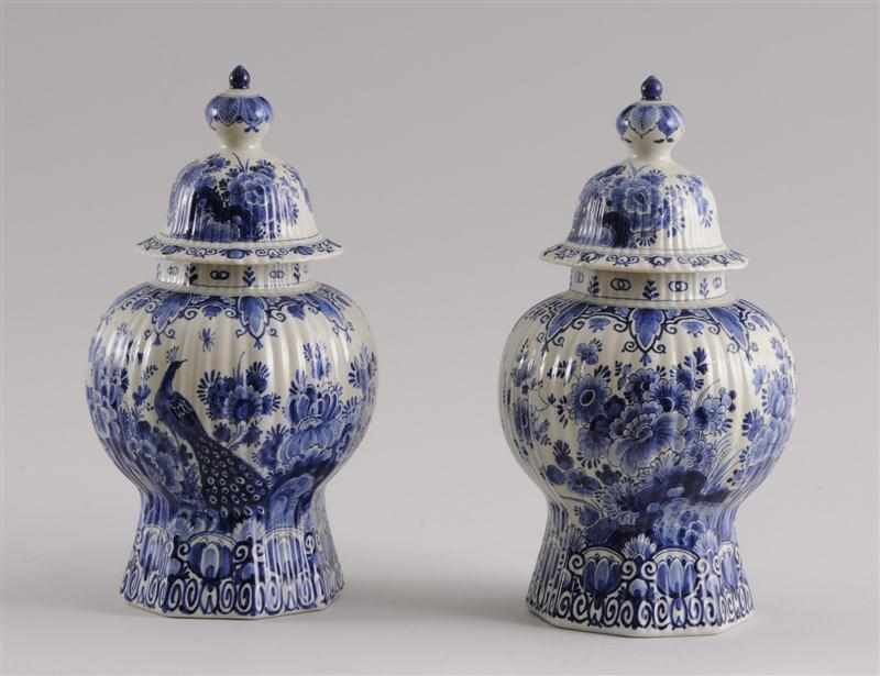 Appraisal: PAIR OF DELFT BLUE AND WHITE OCTAGONAL BALUSTER-FORM JARS AND