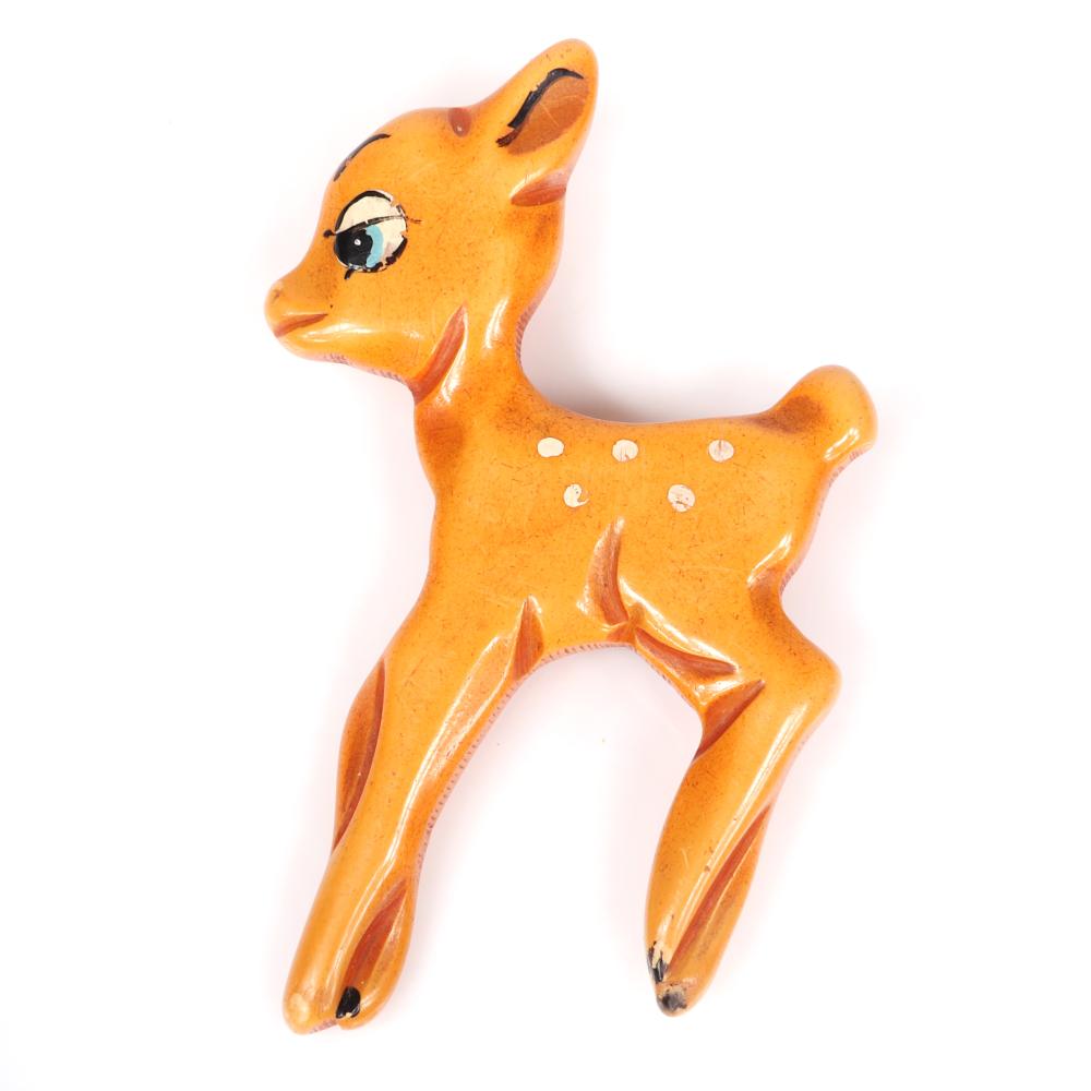 Appraisal: VINTAGE CARVED BAKELITE DISNEY''S BAMBI OVERDYED BUTTERSCOTCH FIGURAL DEER PIN