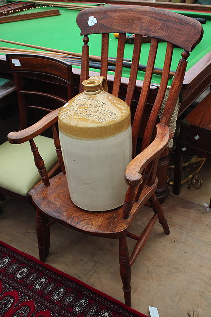 Appraisal: AN OLD ASH AND ELM LATH BACK KITCHEN ARMCHAIR with