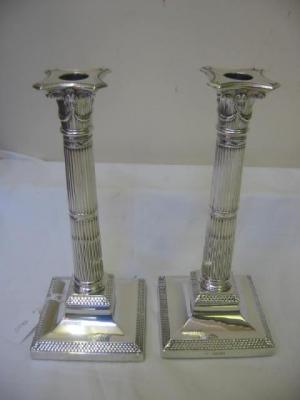 Appraisal: A PAIR OF VICTORIAN CANDLESTICKS of Corinthian column form with