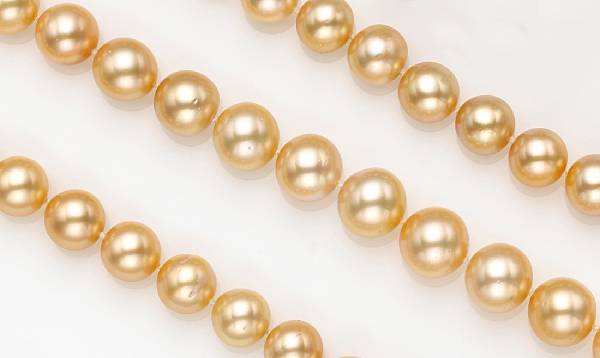 Appraisal: A golden South Sea cultured pearl diamond and fourteen karat