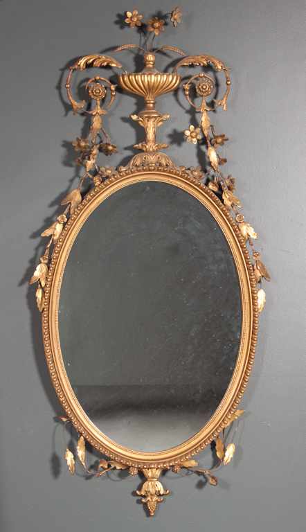 Appraisal: Regency style giltwood and wirework oval mirror with wirework flower