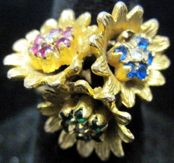 Appraisal: Yellow gold diamond sapphire ruby and emerald 'flower' ring Featuring