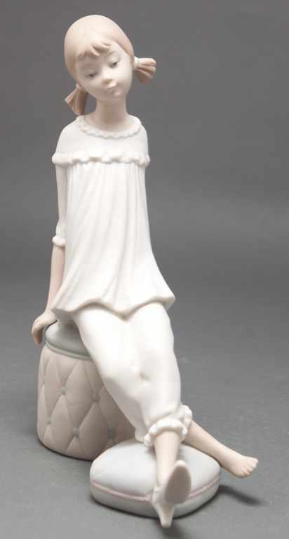 Appraisal: Lladro bisque porcelain figure of a young girl seated on