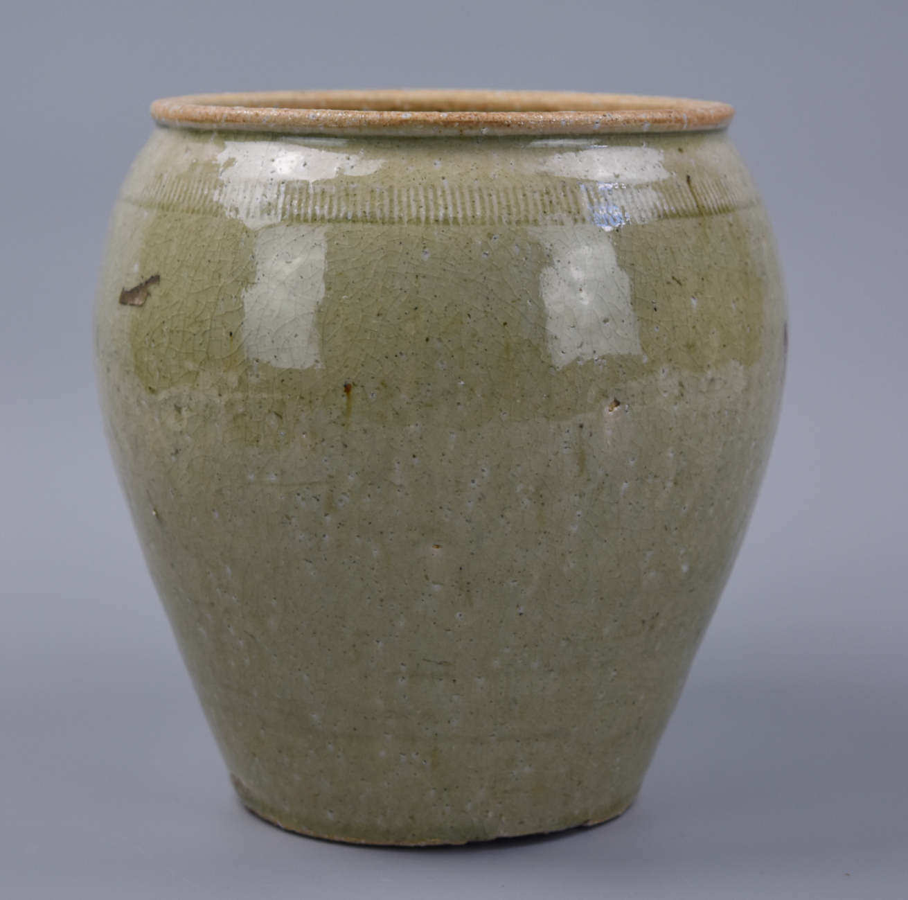 Appraisal: CHINESE CELADON GLAZED JAR QING D A Chinese Qing Dynasty