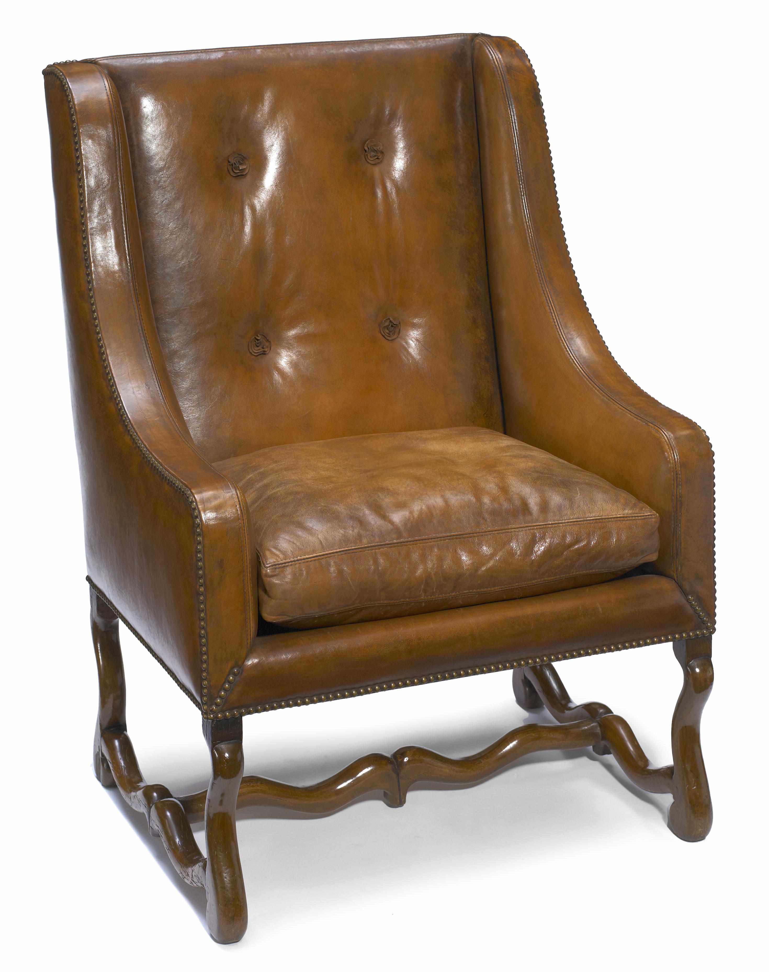 Appraisal: A Louis XIV walnut leather upholstered fauteuil incorporating antique and