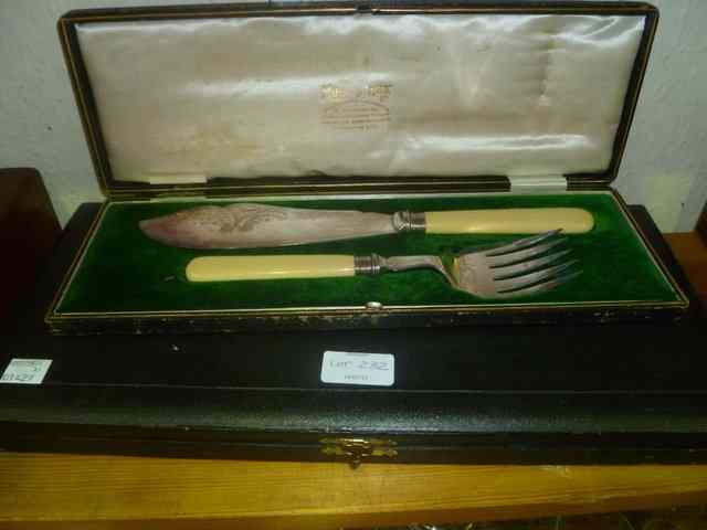 Appraisal: A CASED SILVER AND BONE HANDLED SET OF FISH SERVERS