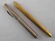 Appraisal: A gilt metal fountain pen with retractable nib together with