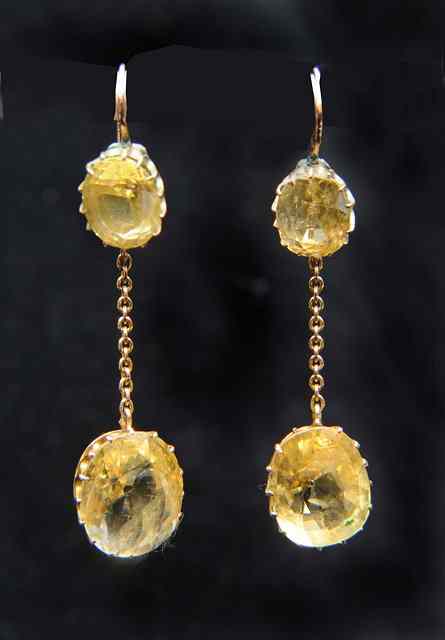 Appraisal: A PAIR OF DROP EARRINGS set with canary yellow faceted