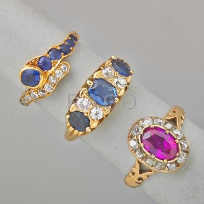 Appraisal: THREE JEWELED GOLD RINGS Tiffany Co diamond and sapphire k