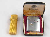 Appraisal: A gold plated Christian Dior gas lighter and a Ronson