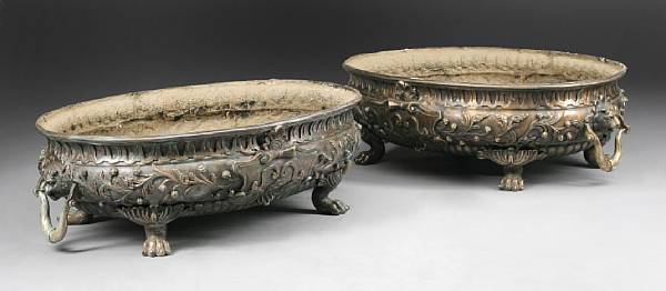 Appraisal: A pair of Neoclassical style patinated bronze jardinieres Each oval