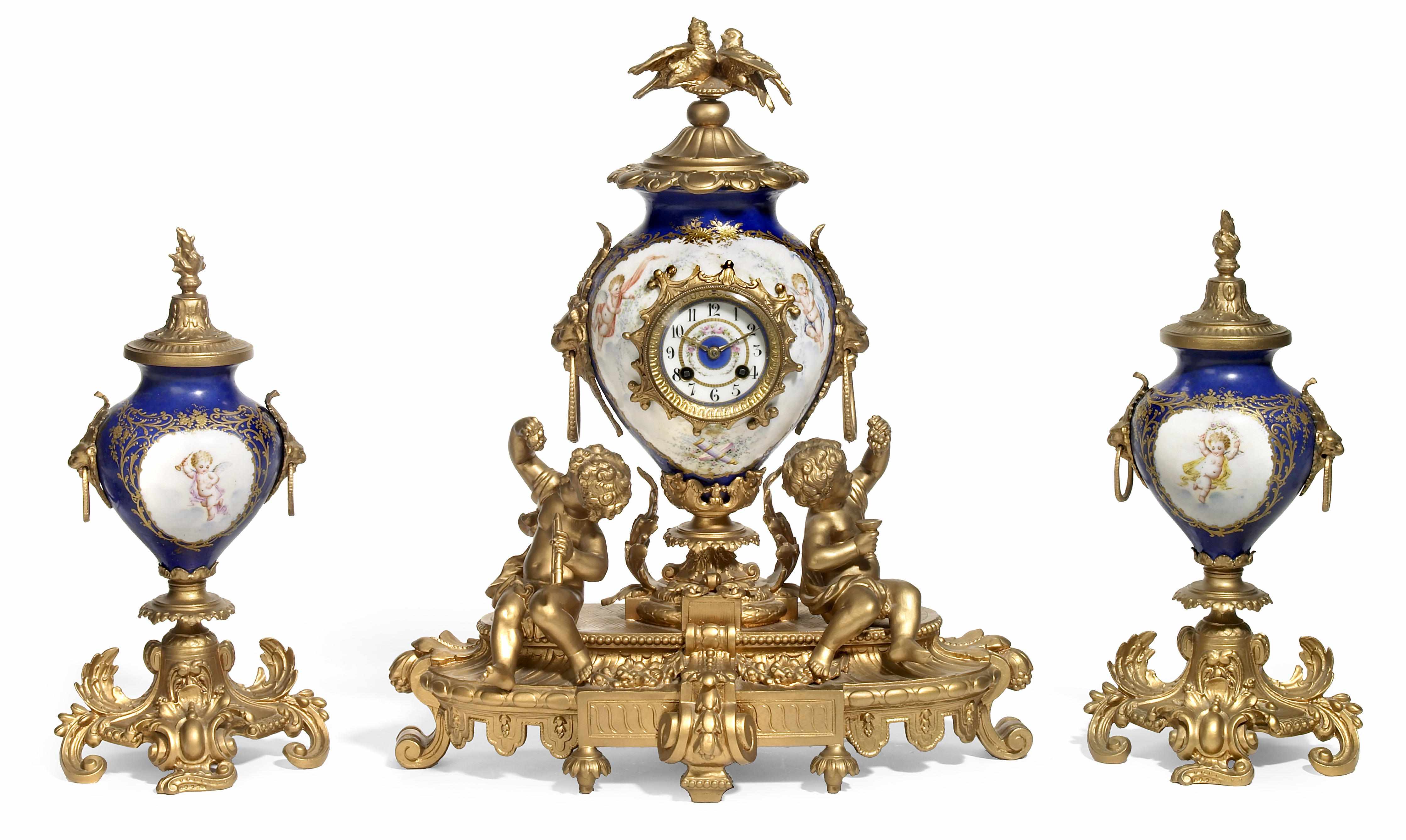 Appraisal: A Svres style gilt metal mounted porcelain clock garniture early