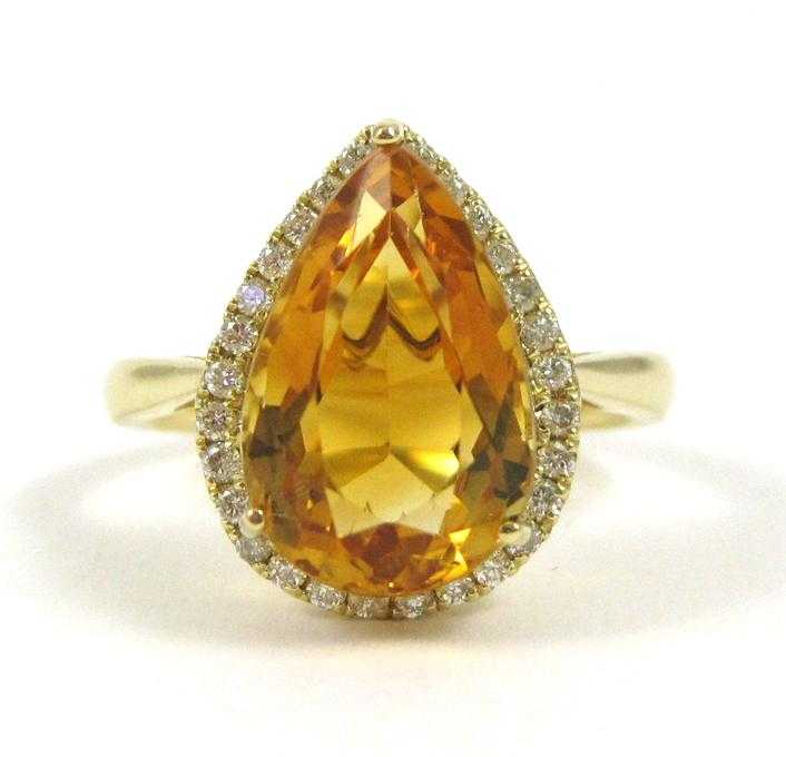 Appraisal: CITRINE DIAMOND AND FOURTEEN KARAT GOLD RING with round-cut diamonds