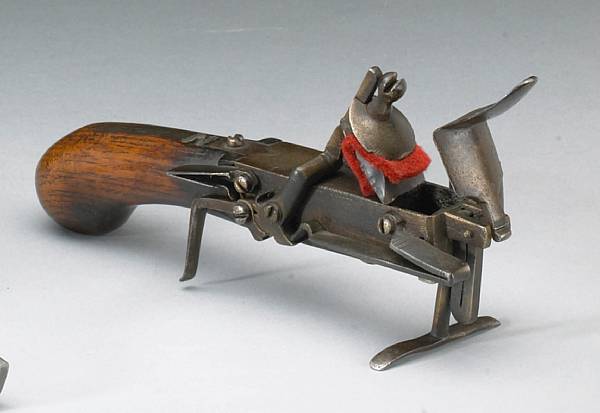 Appraisal: A continental flintlock tinder lighter candlesticklate th or early th