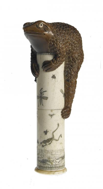 Appraisal: A WOOD AND IVORY CARVING OF A TOAD ON A