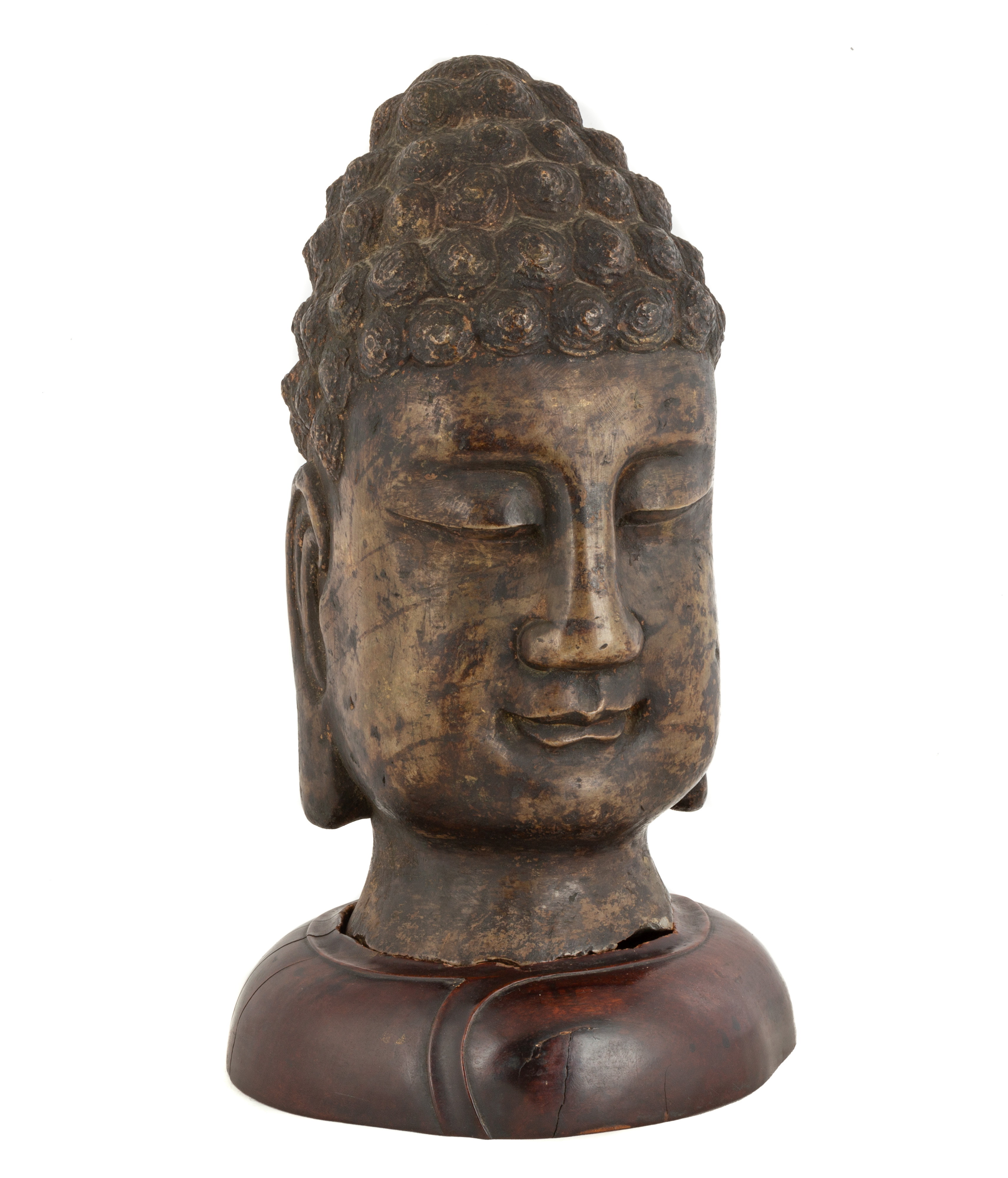 Appraisal: CHINESE STONE BUDDHA HEAD on a carved wooden base