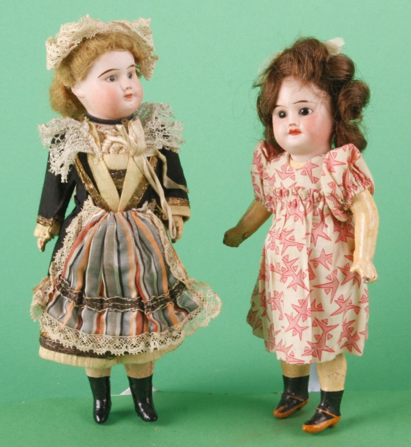 Appraisal: Pair of SFBJ PARIS dolls Has stationary black eyes and