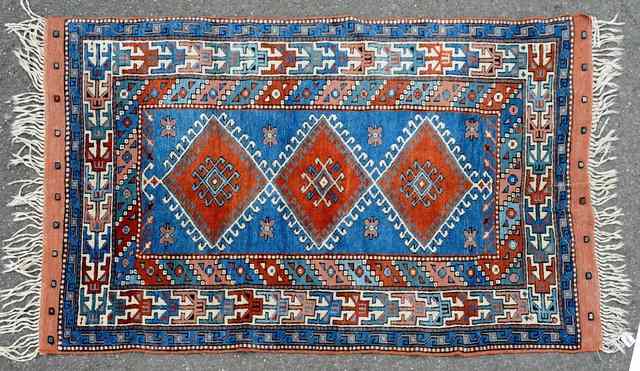 Appraisal: A KASAK BLUE GROUND RUG decorated with a triple central