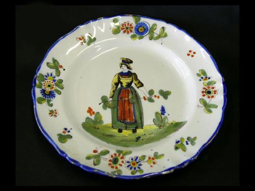 Appraisal: French Faience Dinner Plate in Provincial Woman decor Moustier first