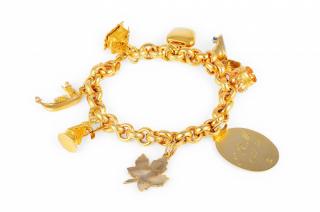 Appraisal: A Gold Charm Bracelet A Gold Charm Bracelet Featuring nine