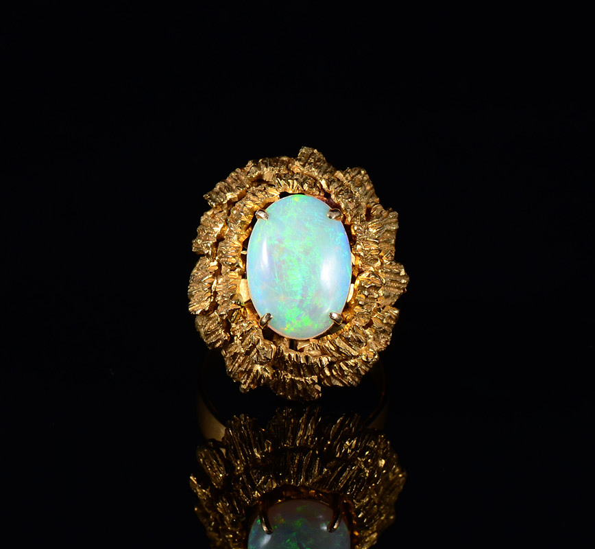 Appraisal: FIERY CT OPAL RING K yellow gold in a retro