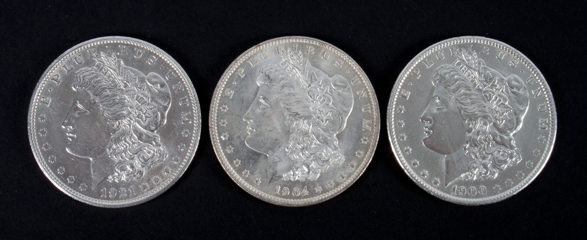 Appraisal: Three United States Morgan dollars -' comprising -O -O and