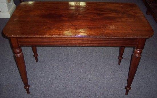 Appraisal: A th Century mahogany serving table on turned octagonal legs