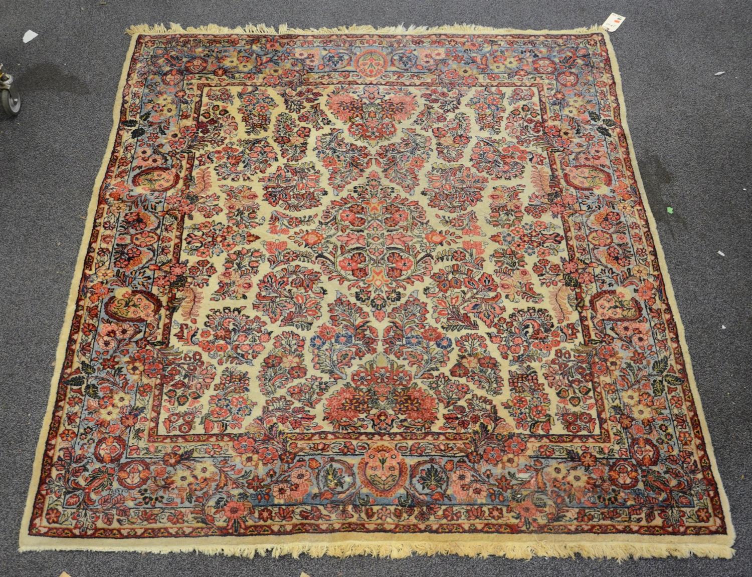 Appraisal: x Kirman rug with wear and losses