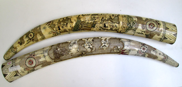 Appraisal: PAIR OF CHINESE CARVED BONE TUSKS scrimshawed and with figural