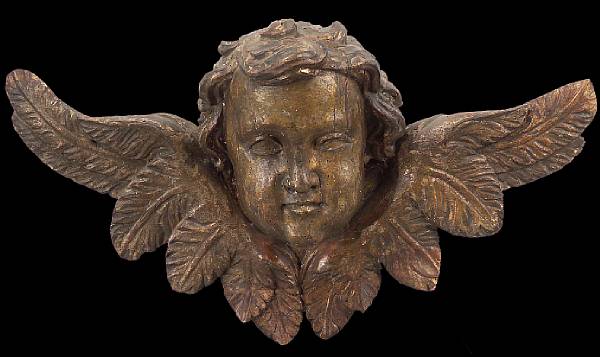 Appraisal: A Baroque giltwood amorino th century Depicted with full cheeks