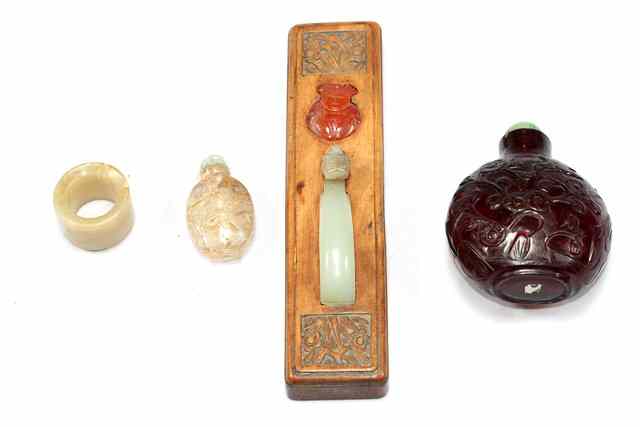 Appraisal: A CHINESE JADE BELT BUCKLE with carved terminal and a