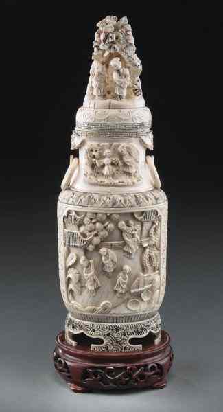 Appraisal: Chinese carved ivory vase the finial depicting figures celebrating the