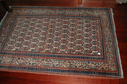 Appraisal: THREE PERSIAN FLOOR RUGS Each with a geometric design the