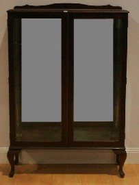 Appraisal: A reproduction mahogany two-door display cabinet cm wide cm deep