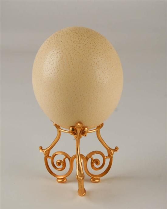 Appraisal: A Large Ostrich Egg on Stand the egg with contents